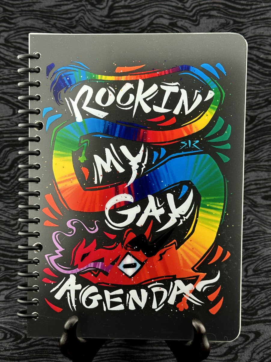 Front cover featuring rainbow dragon with 'rockin' my gay agenda' text on a black background.