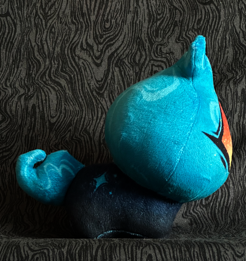 Side view, plush toy "Baby Bambi" Blue flame, Orange eye. Blue-black body.