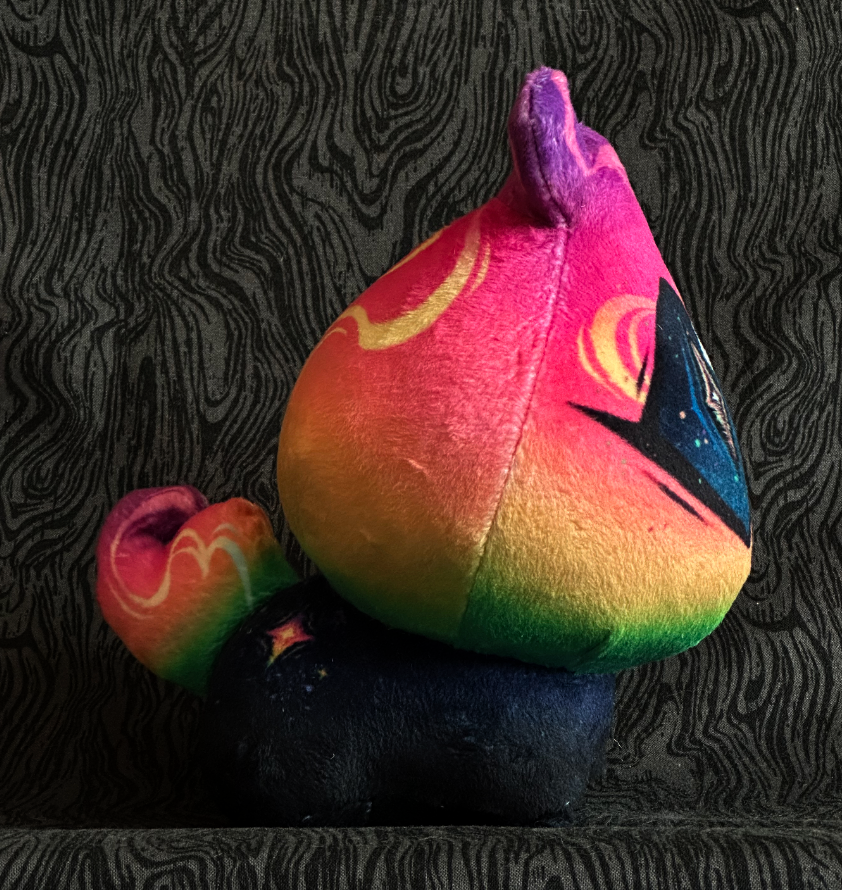 Side view, plush toy "Baby Bambi" tropical rainbow flame, navy eye. blue-black body.