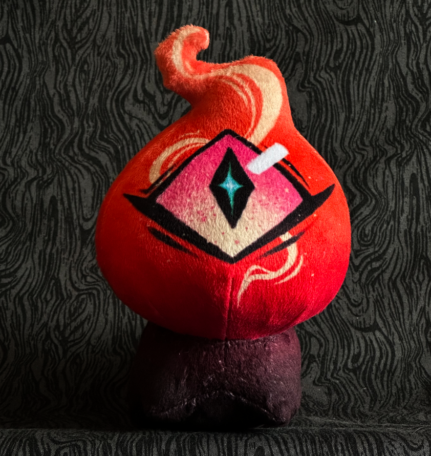 Front view, plush toy "Baby Bambi" pink and orange flame, pink and cream eye. mauve-black body.