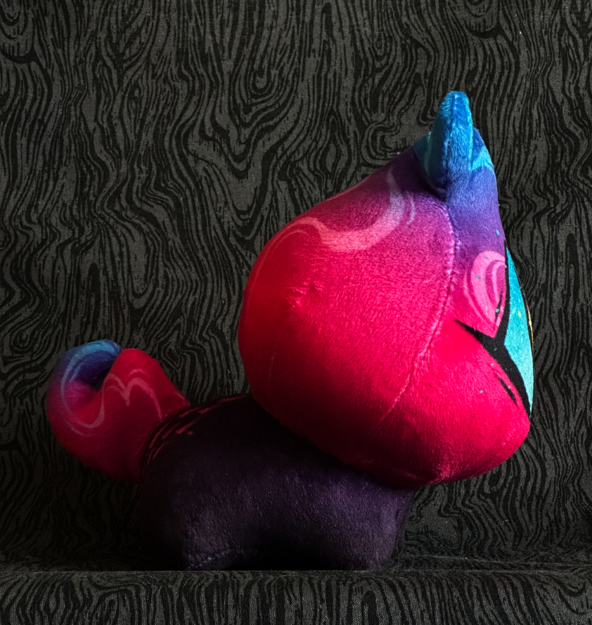 Side view of plush toy "Baby Bambi" Pink and blue flame, blue eye. purple-black body.