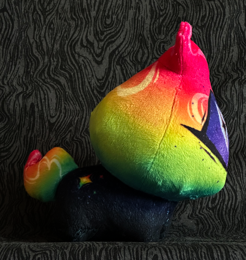 Side view, plush toy "Baby Bambi" Neon rainbow flame, Purple eye. blue-black body.